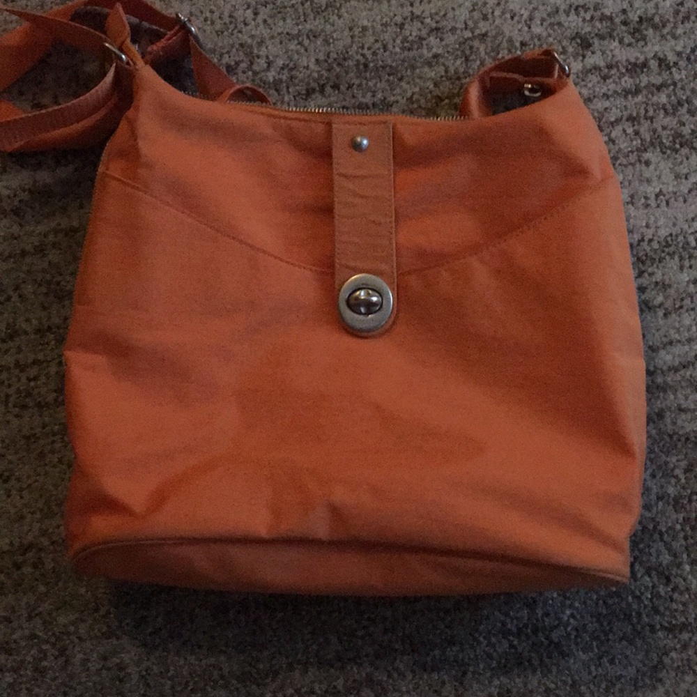 Baggallini orange travel purse